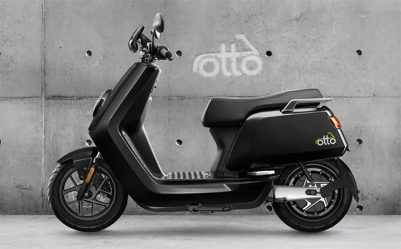 Otto-branded NIU fleet against the workshop wall